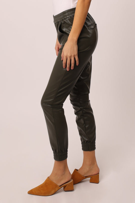 image of a female model wearing a JACEY SUPER HIGH RISE CROPPED JOGGER PANTS CHARLESTON GREEN DEAR JOHN DENIM 