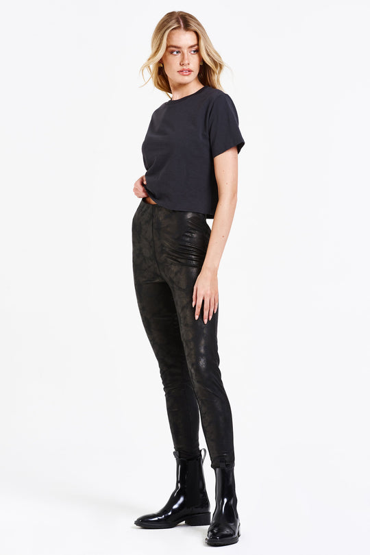image of a female model wearing a DAPHNE SUPER HIGH RISE ANKLE LEGGING BLACK COATED DEAR JOHN DENIM 