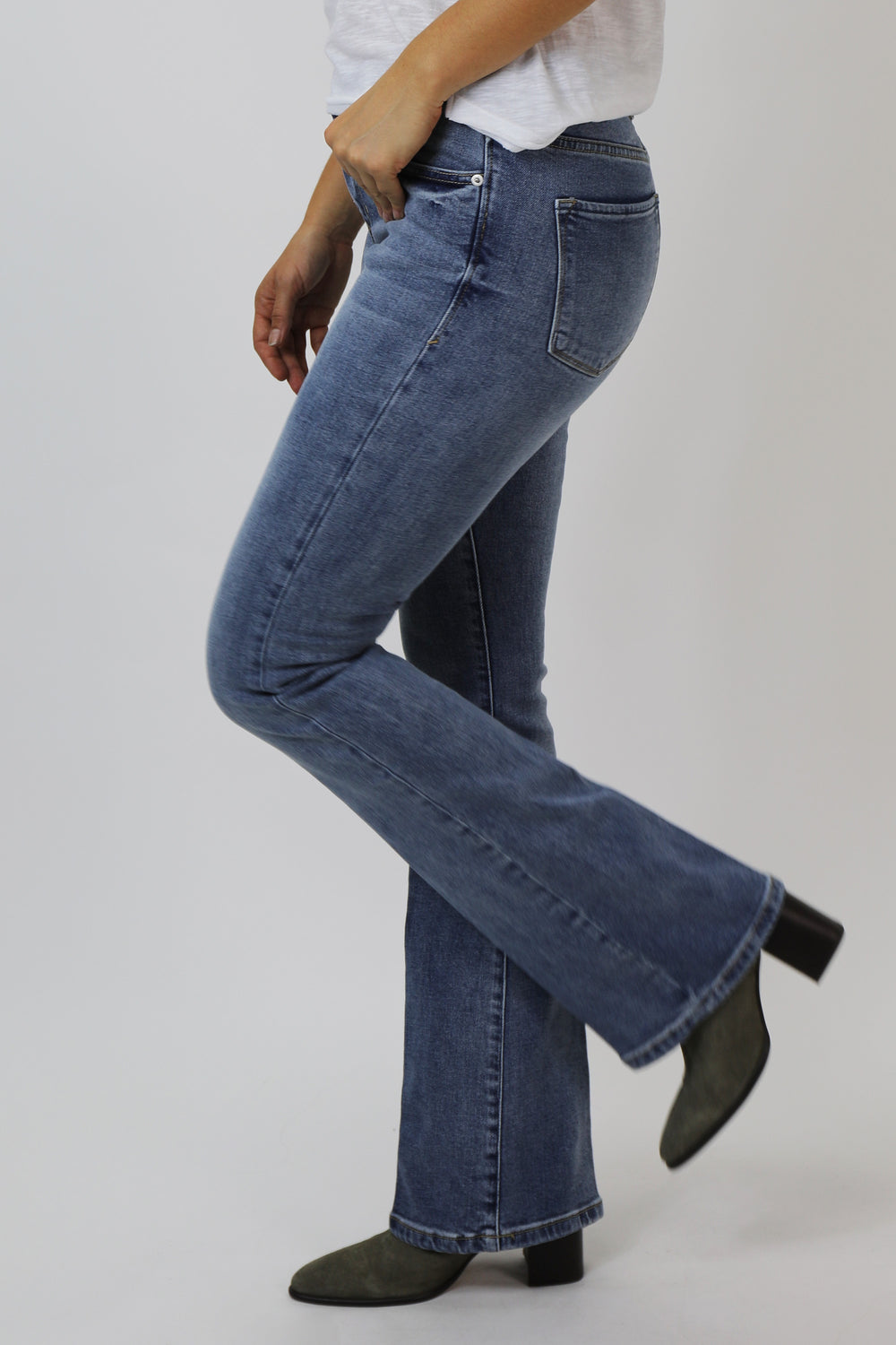 image of a female model wearing a JAXTYN HIGH RISE BOOTCUT JEANS WAIKIKI DEAR JOHN DENIM 