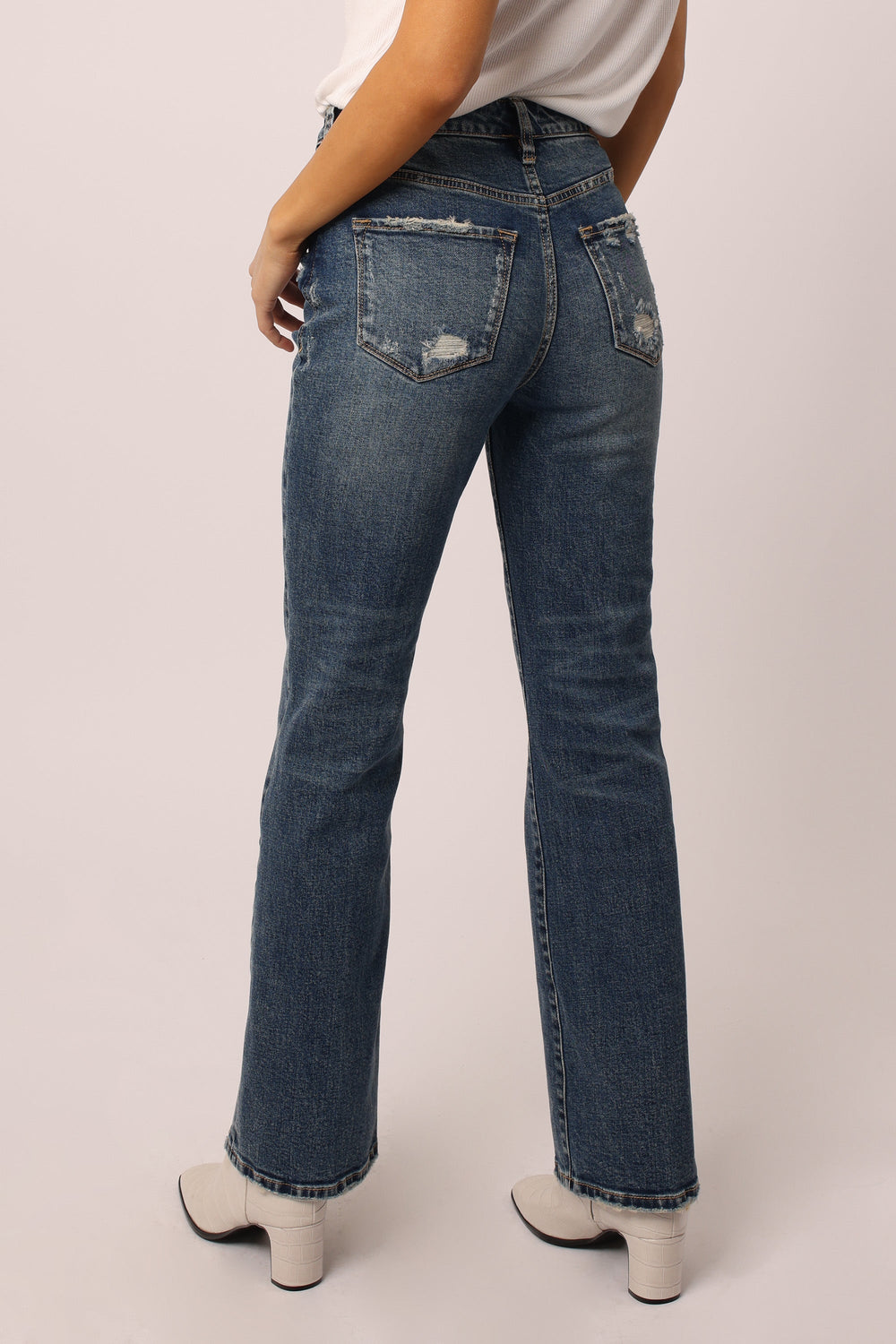 image of a female model wearing a PARIS SUPER HIGH RISE BOOTCUT JEANS VISTA DEAR JOHN DENIM 