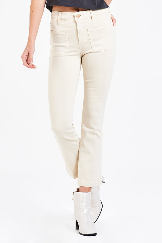 image of a female model wearing a JEANNE SUPER HIGH RISE CROPPED FLARE LEG JEANS VANILLA JEANS