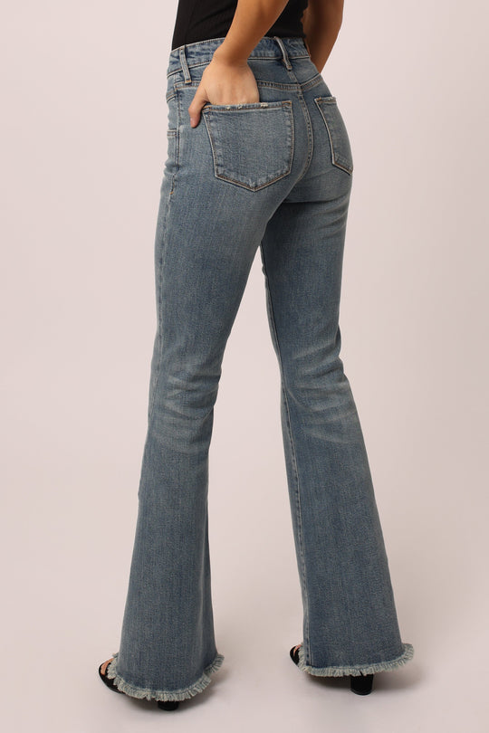 image of a female model wearing a ROSA HIGH RISE FLARE JEANS STOKES CANYON DEAR JOHN DENIM 