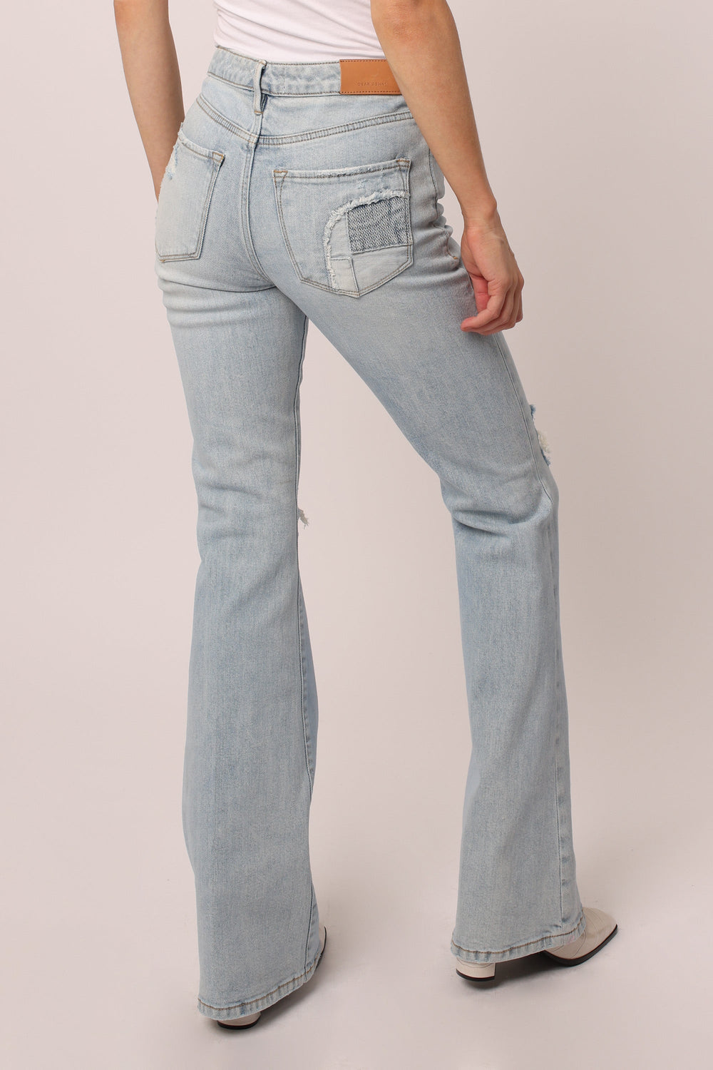 image of a female model wearing a LANEY HIGH RISE FLARE LEG JEANS WINDMILL JEANS