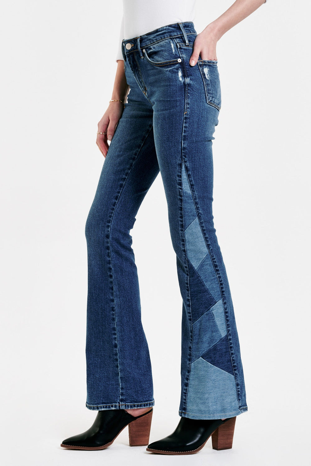 image of a female model wearing a ROSA HIGH RISE FLARE JEANS HIMALAYAN JEANS