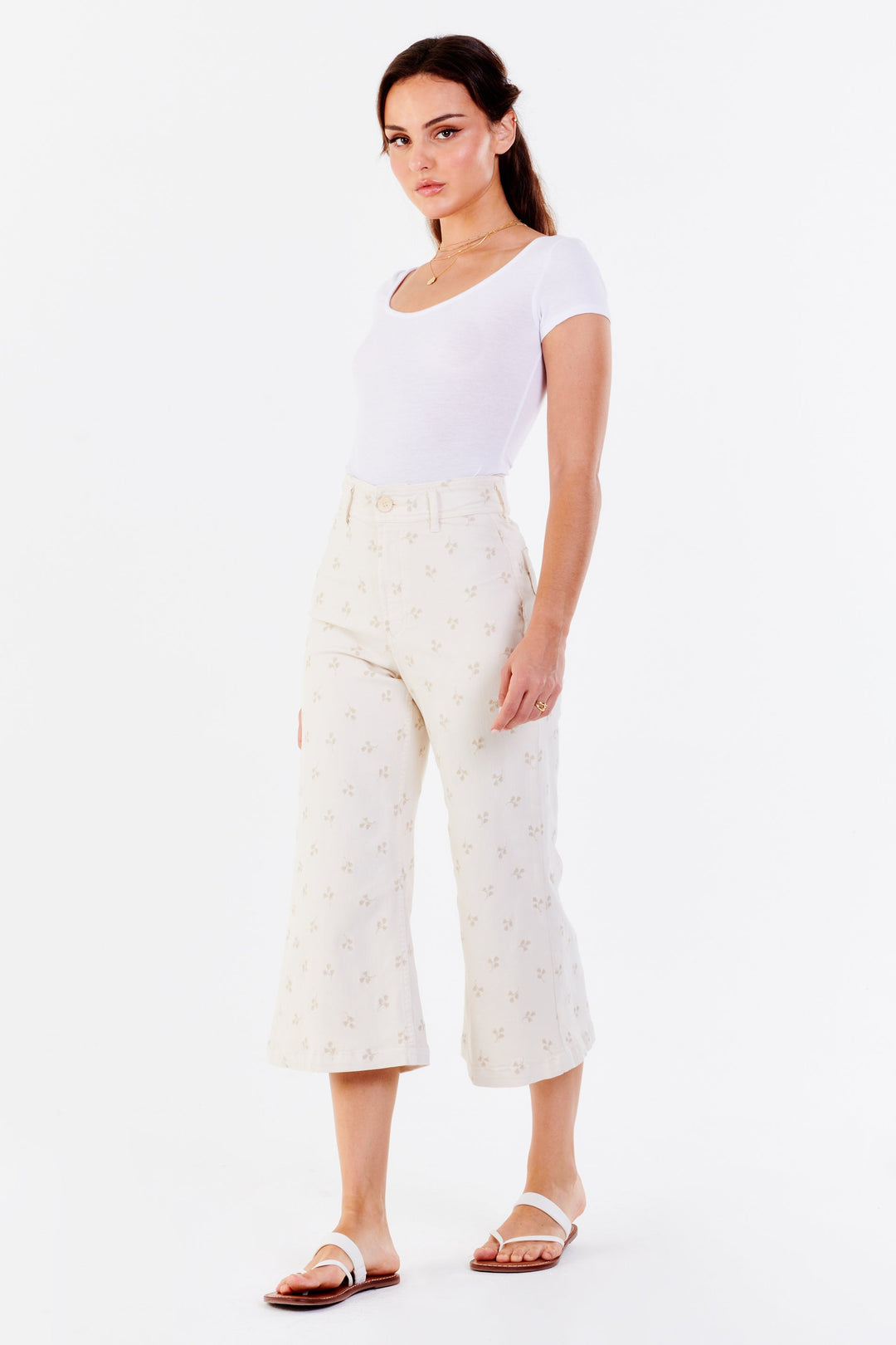 image of a female model wearing a AUDREY SUPER HIGH RISE CROPPED WIDE LEG PANTS FLORAL WHEAT | DEAR JOHN JEANS