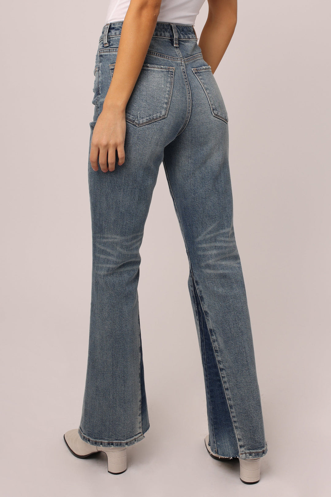 image of a female model wearing a OLIVER SUPER HIGH RISE BOOTCUT JEANS PRAGUE JEANS