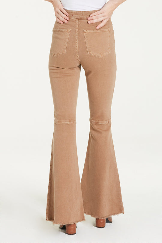 image of a female model wearing a VIVIAN SUPER HIGH RISE SUPER FLARE HAZELNUT JEANS DEAR JOHN DENIM 