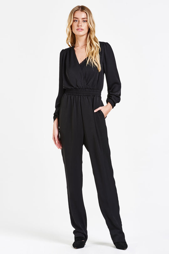 image of a female model wearing a BROOKE SILKY WRAP ROMPER IRON JUMPSUITS