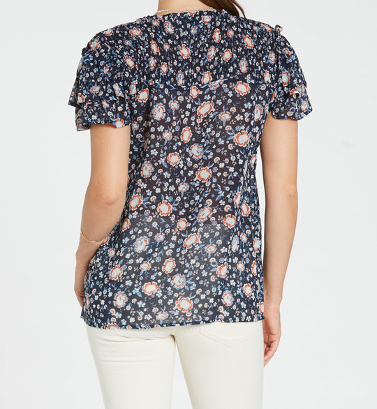 image of a female model wearing a CARRIE TOP IN BLUE FLORAL SHIRTS