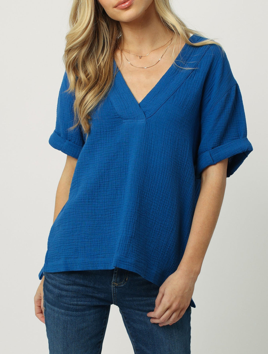 image of a female model wearing a JAILEE SHORT SLEEVE V NECK TOP LAPIS BLUE TOPS
