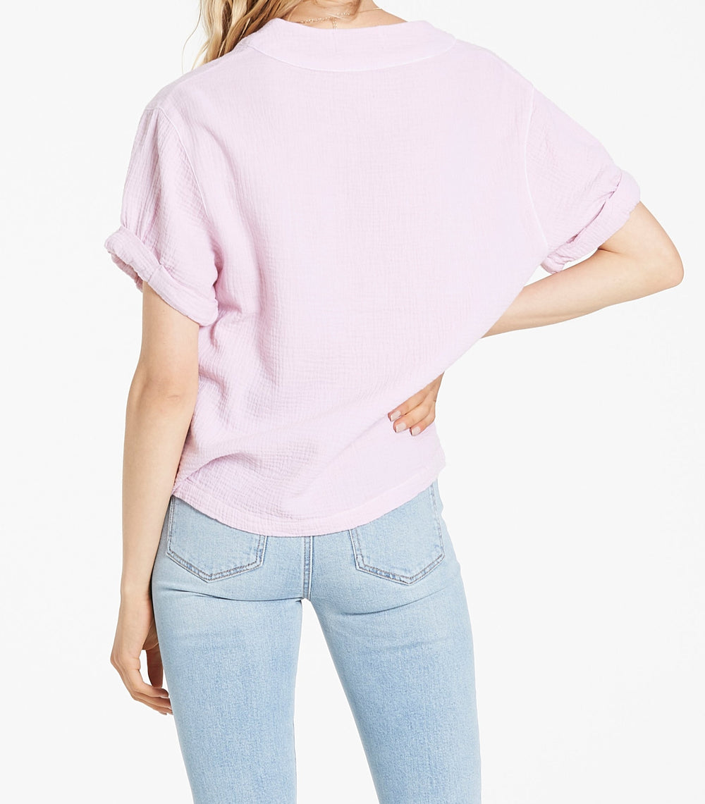 image of a female model wearing a JAILEE ROLLED SLEEVE TOP PEARL BLUSH TOPS
