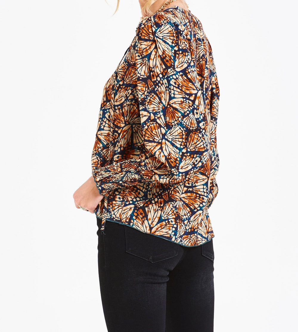 image of a female model wearing a AMELIA RUCHED LONG SLEEVE TOP BUTTERFLY PRALINE DEAR JOHN DENIM 