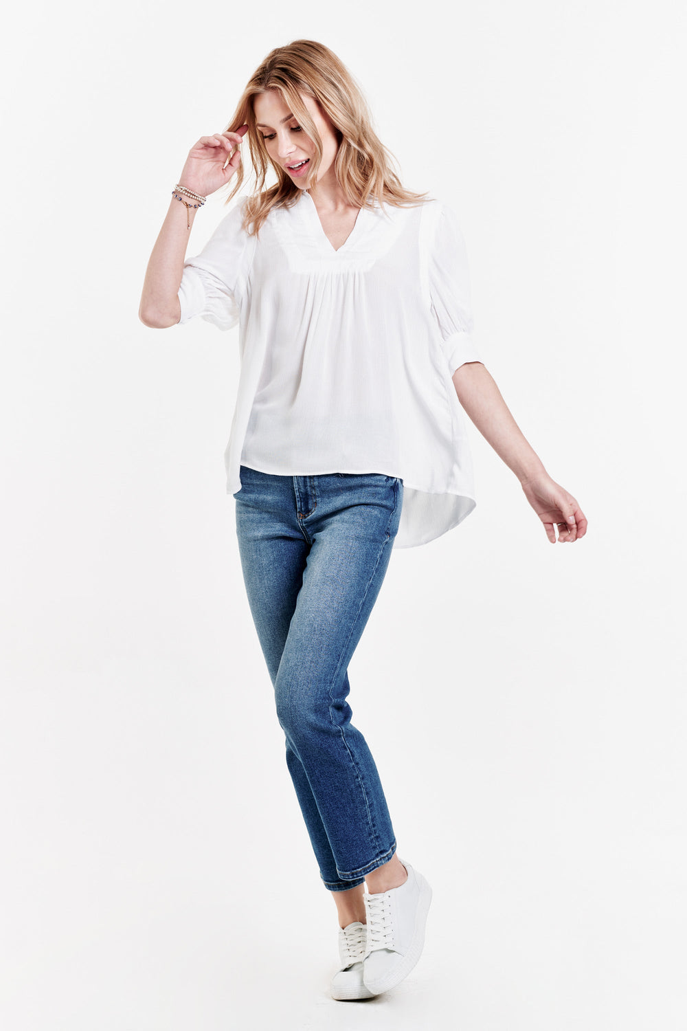 image of a female model wearing a RAVEN PUFF CUFF TUNIC TOP WHITE TOPS