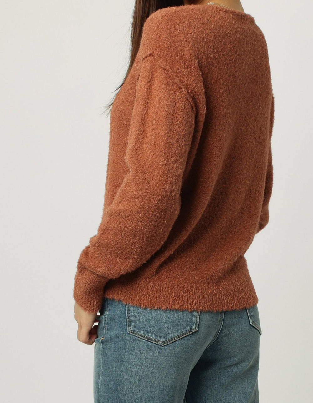 image of a female model wearing a CALLEEN V-NECK LONG SLEEVE SWEATER AMBER STONE DEAR JOHN DENIM 