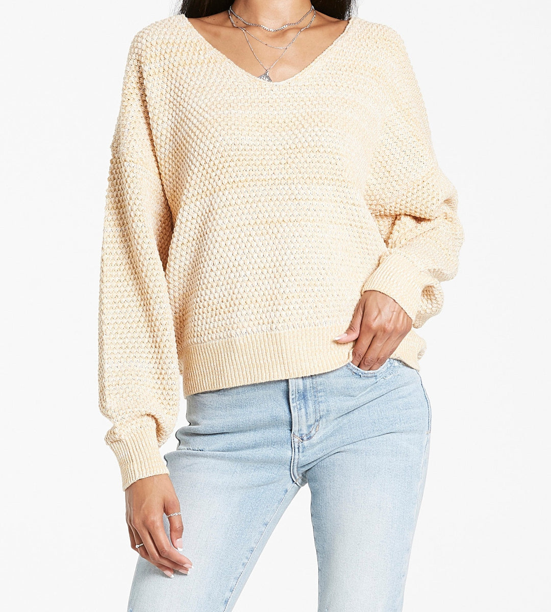 image of a female model wearing a LEXI SPECKLED SWEATER APRICOT CREAM SWEATERS