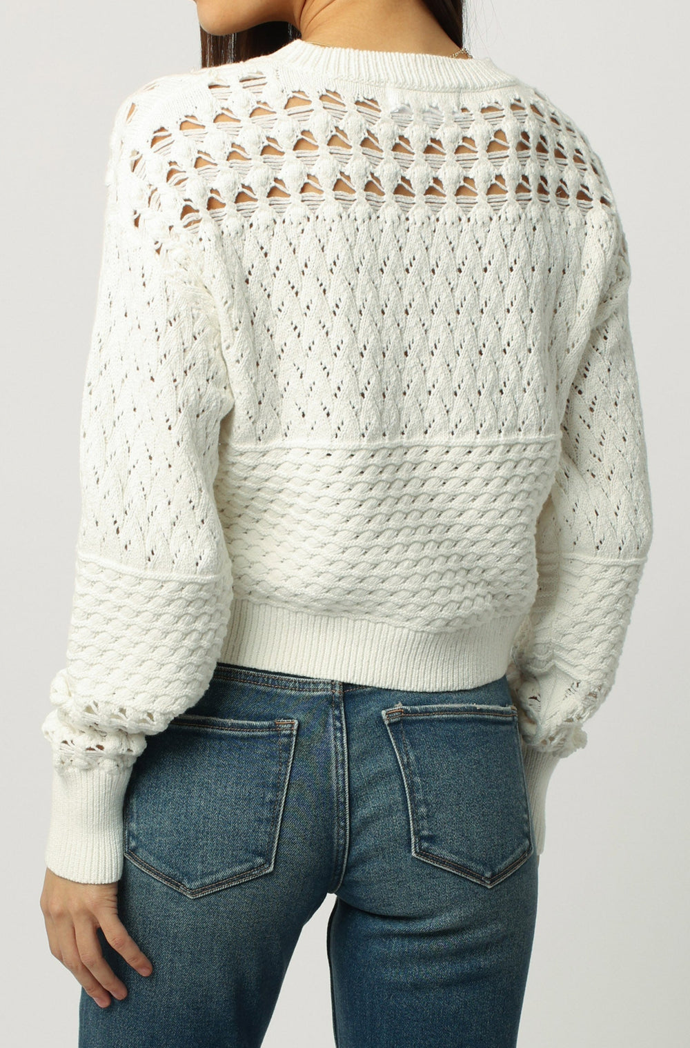 image of a female model wearing a ABIGAIL CROPPED LONG SLEEVE SWEATER SOFT CREAM DEAR JOHN DENIM 