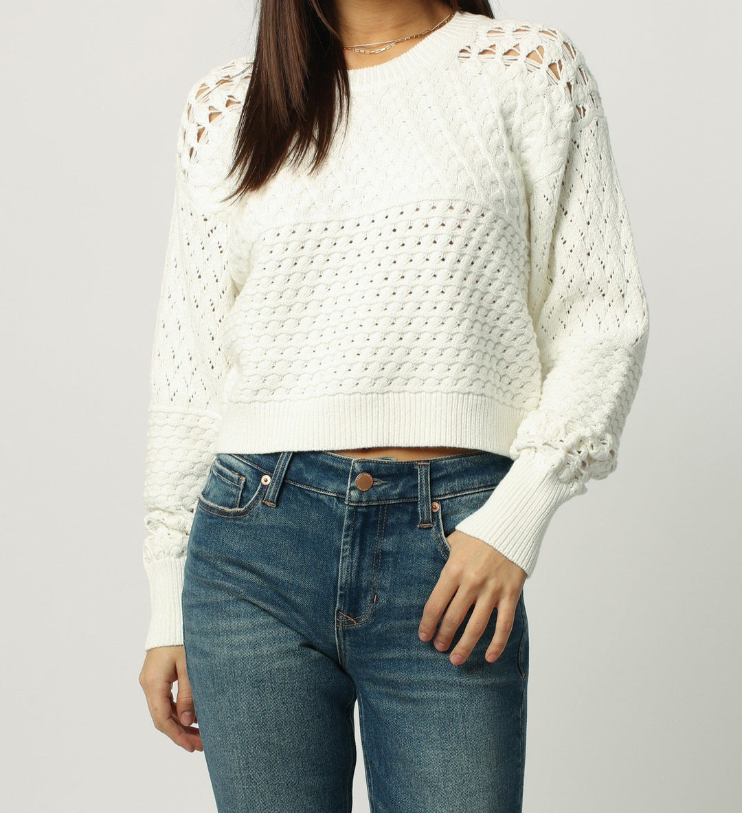 image of a female model wearing a ABIGAIL CROPPED LONG SLEEVE SWEATER SOFT CREAM SWEATERS