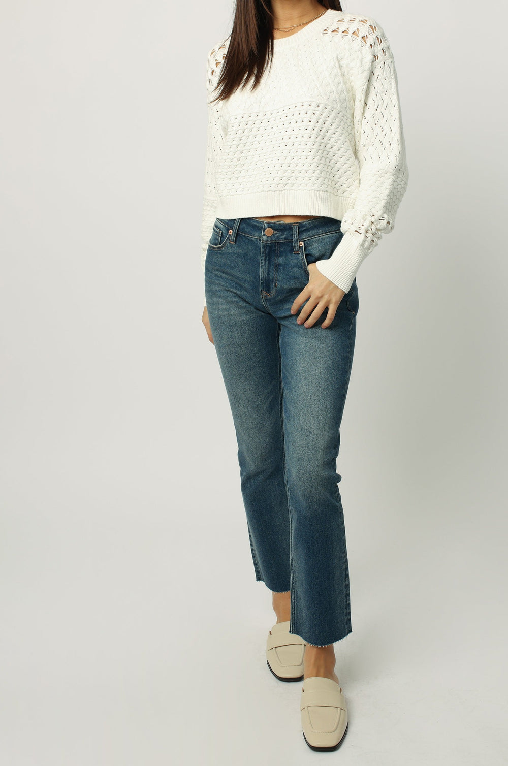 image of a female model wearing a ABIGAIL CROPPED LONG SLEEVE SWEATER SOFT CREAM SWEATERS