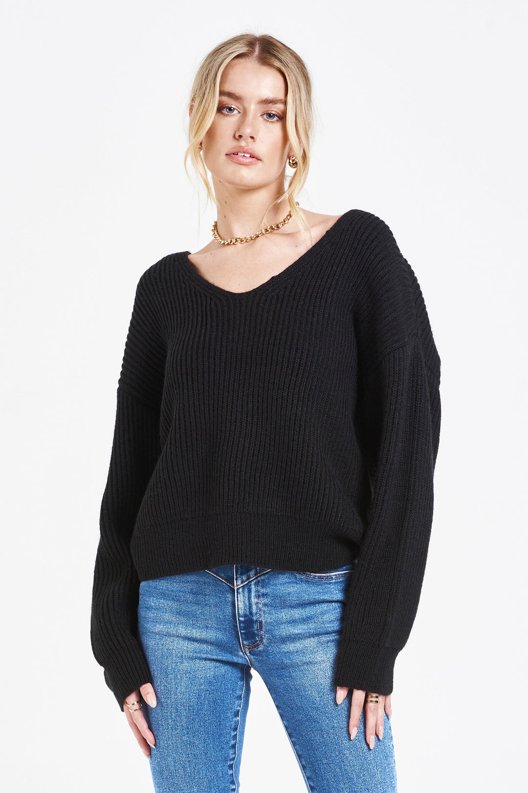image of a female model wearing a ORION BACK KNOT SWEATER BLACK SWEATERS