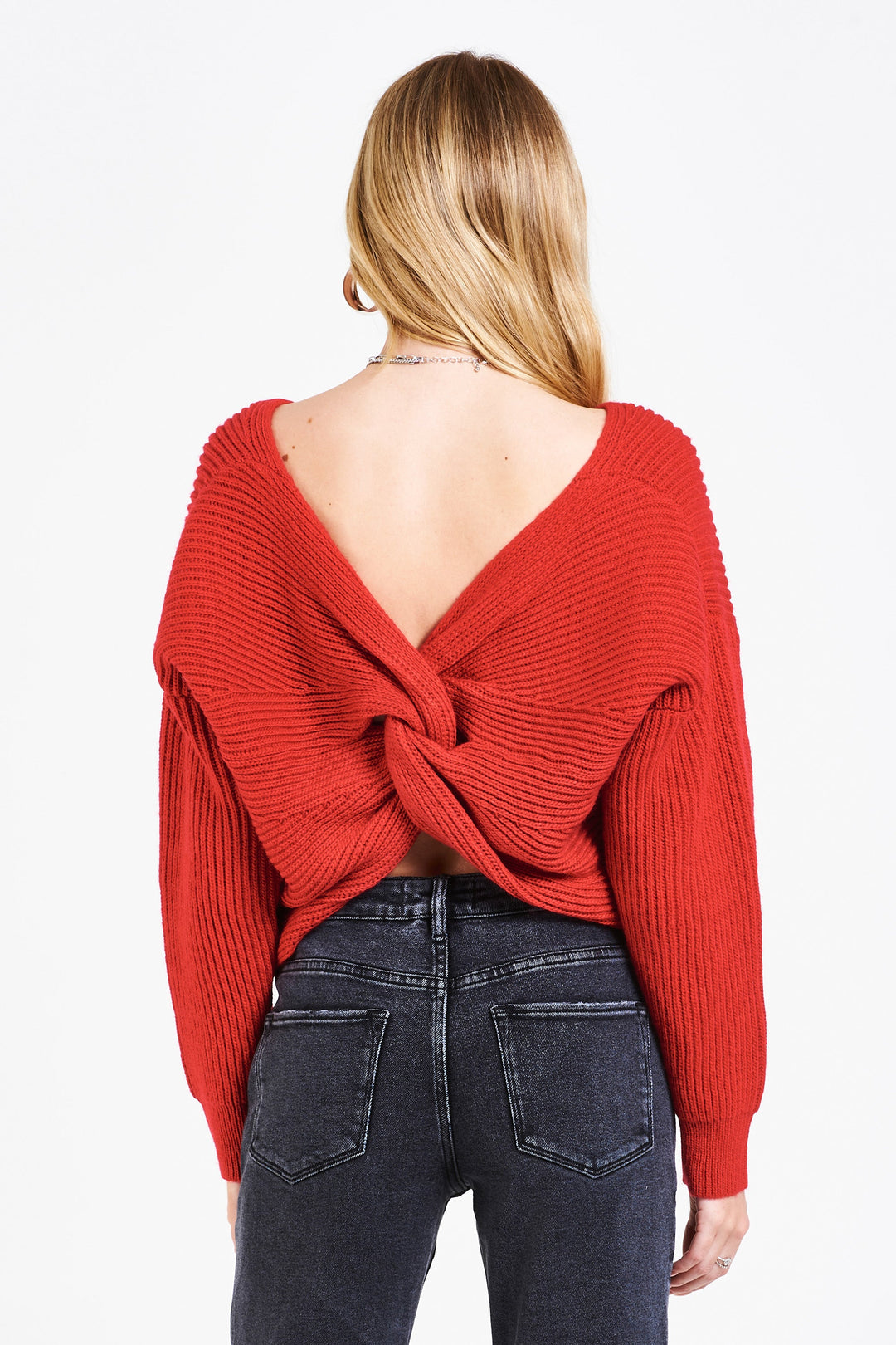 image of a female model wearing a ORION BACK KNOT SWEATER MERRY RED SWEATERS