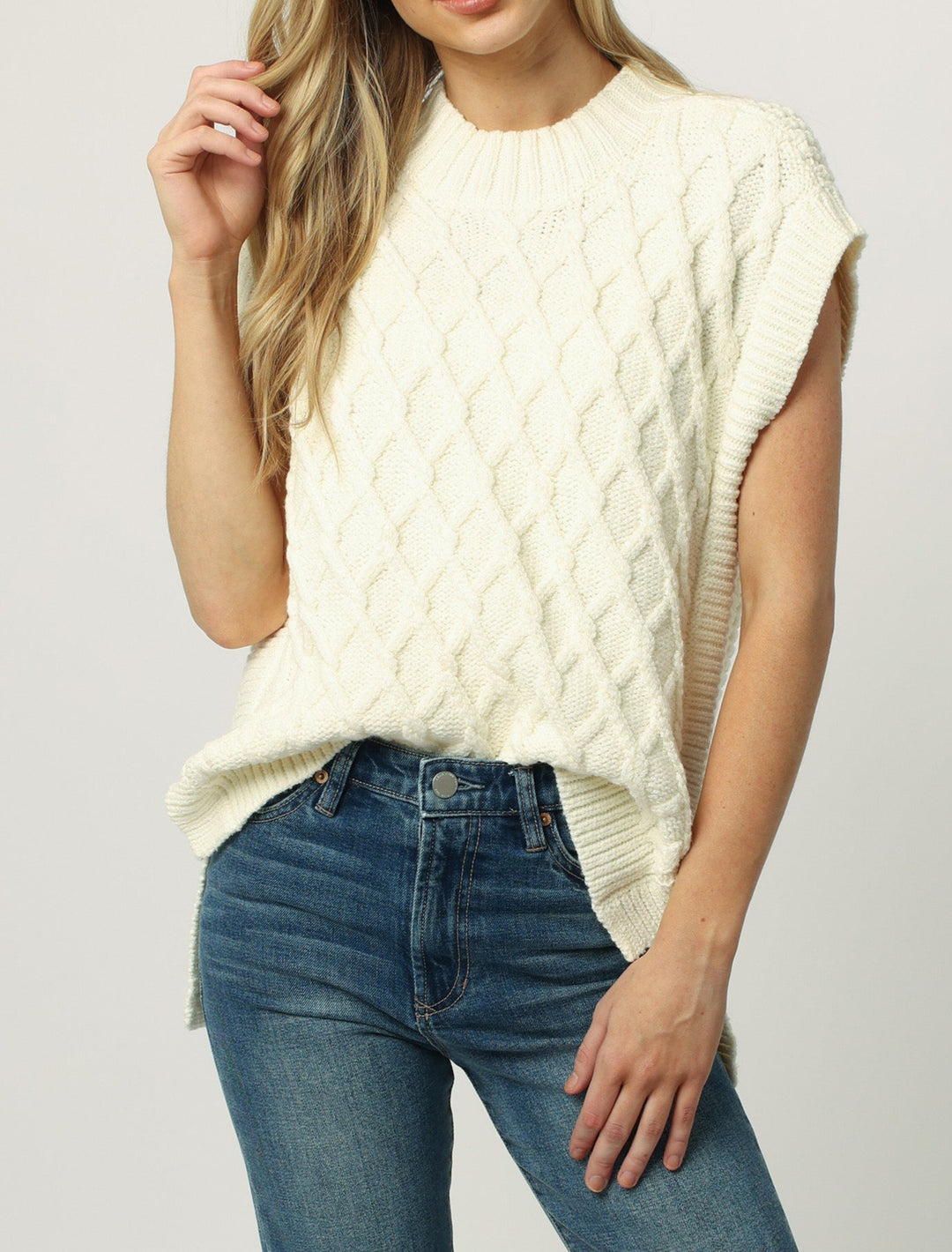 image of a female model wearing a BRIANA WIDE NECK SWEATER VEST MILK FROTH SWEATERS