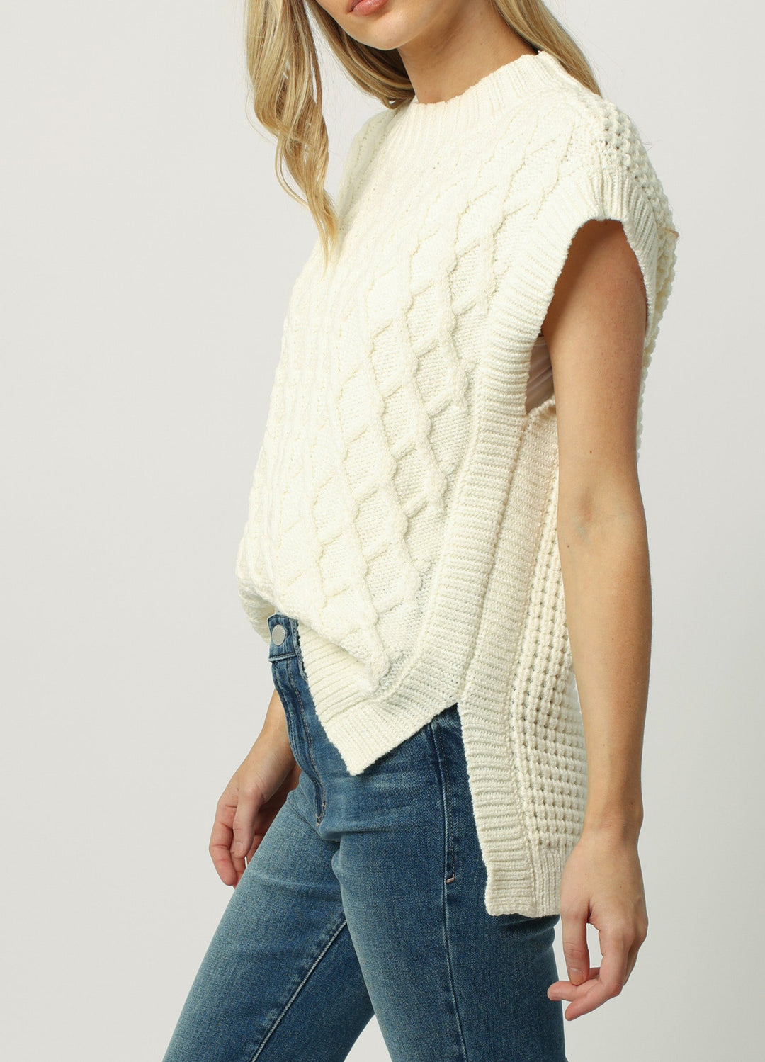 image of a female model wearing a BRIANA WIDE NECK SWEATER VEST MILK FROTH SWEATERS