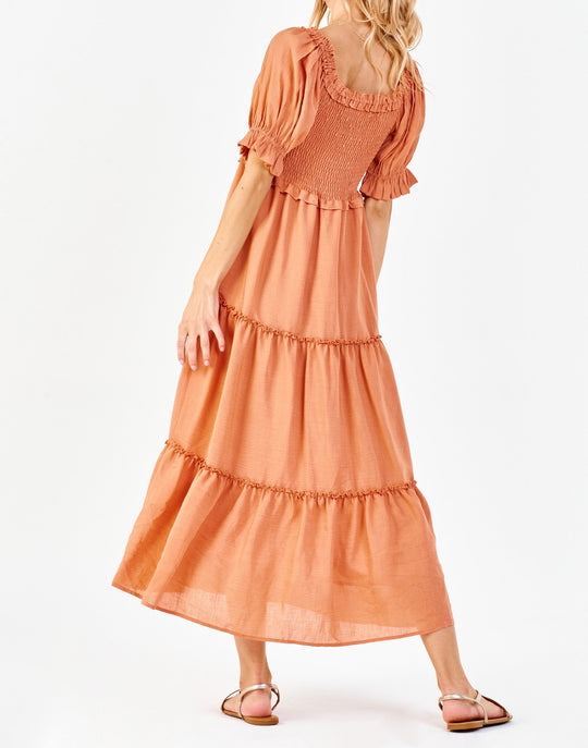 image of a female model wearing a SHELBY SMOCKED BODICE DRESS SOFT APRICOT DEAR JOHN DENIM 