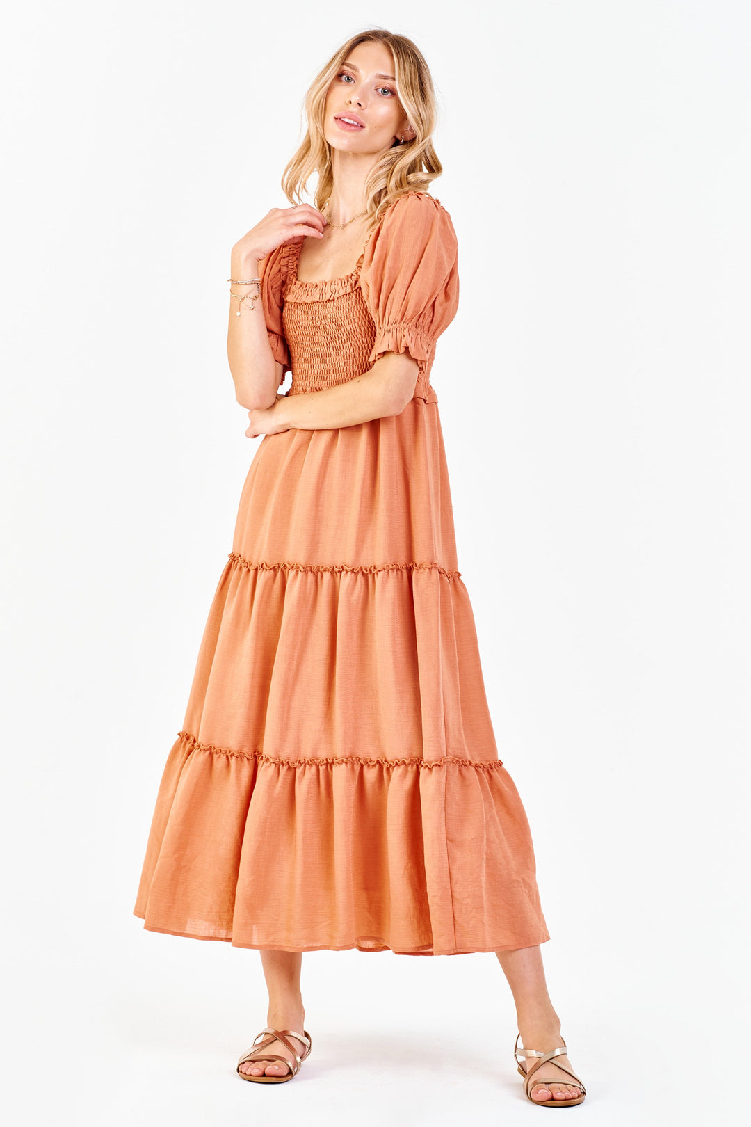 image of a female model wearing a SHELBY SMOCKED BODICE DRESS SOFT APRICOT DEAR JOHN DENIM 