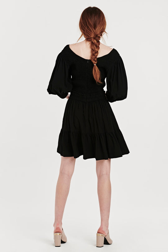 image of a female model wearing a CHRISTINA SMOCKED BODICE DRESS BLACK DEAR JOHN DENIM 