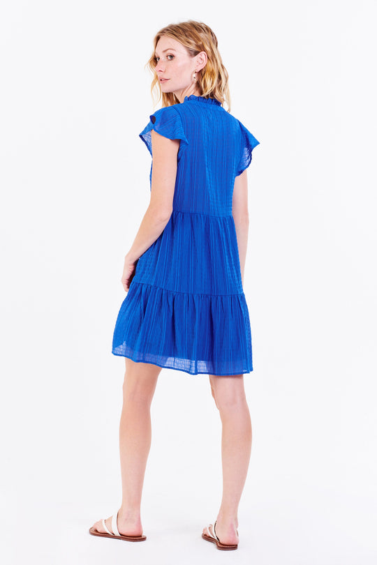 image of a female model wearing a GUINEVERE PETAL SLEEVE DRESS IRIS BLUE DEAR JOHN DENIM 