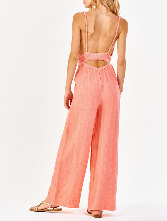 image of a female model wearing a IMANI STRAP HALTER JUMPSUIT SWEET PEACH DEAR JOHN DENIM 