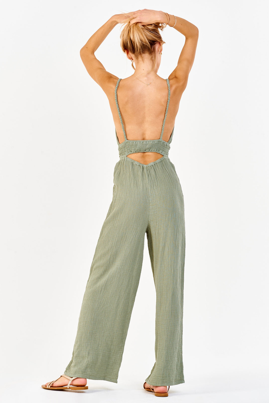 image of a female model wearing a IMANI STRAP HALTER JUMPSUIT SWEET OLIVE DEAR JOHN DENIM 