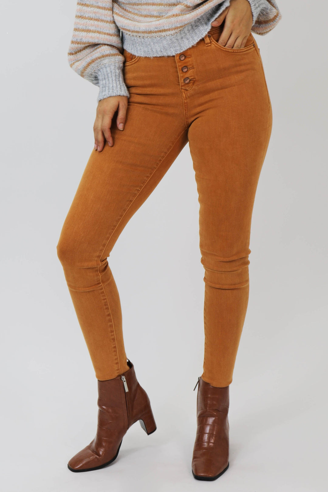 image of a female model wearing a GISELE HIGH RISE ANKLE SKINNY JEANS MACCHIATO JEANS