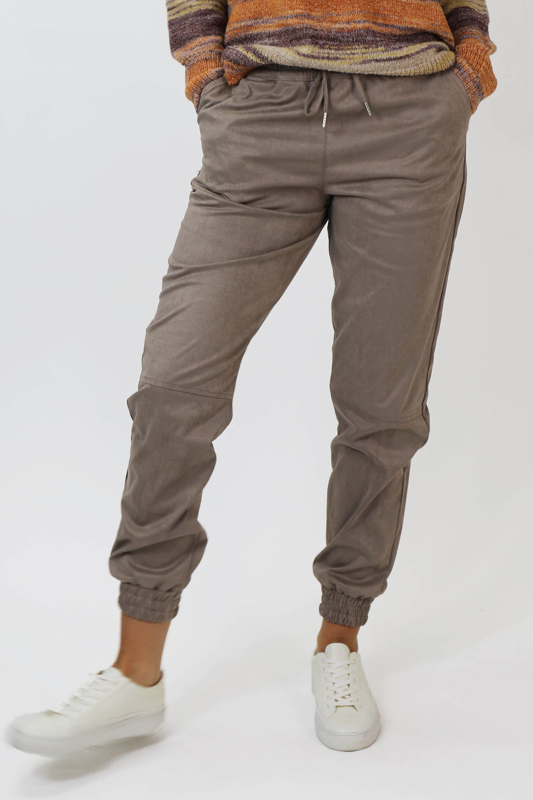 image of a female model wearing a JACEY SUPER HIGH RISE CROPPED JOGGER PANTS CHOCOLATE PANTS