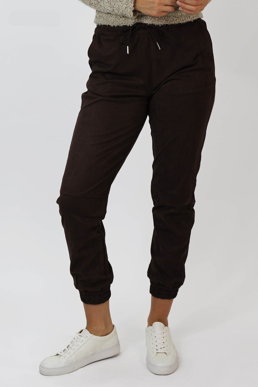 image of a female model wearing a JACEY SUPER HIGH RISE CROPPED JOGGER PANTS MACAROON PANTS