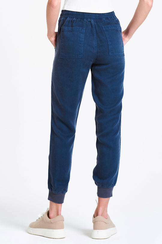 image of a female model wearing a JACEY SUPER HIGH RISE CROPPED JOGGER PANTS BLUE OPAL PANTS