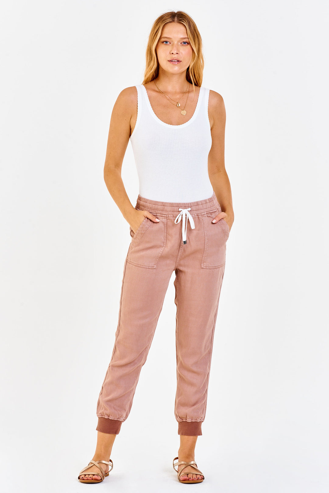 image of a female model wearing a JACEY SUPER HIGH RISE CROPPED JOGGER PANTS CLAY PANTS