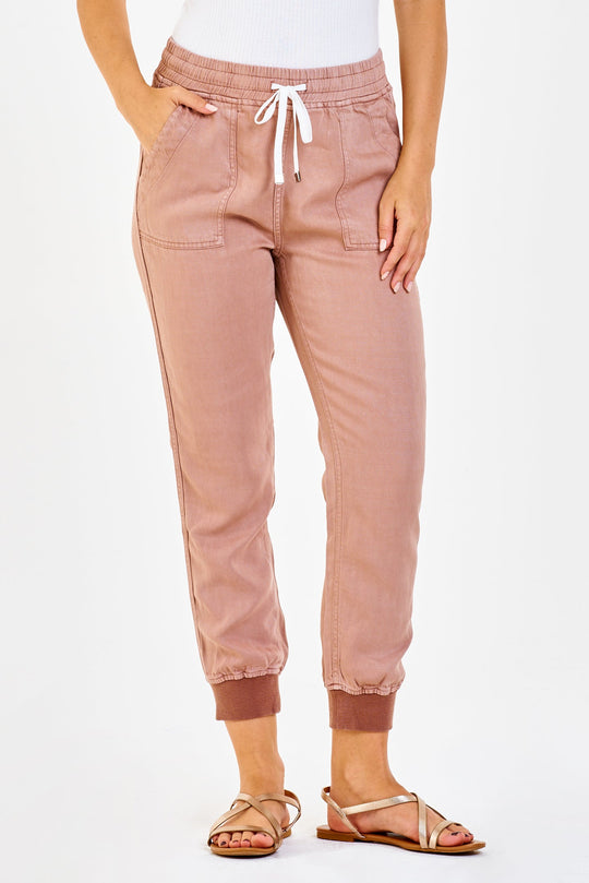 image of a female model wearing a JACEY SUPER HIGH RISE CROPPED JOGGER PANTS CLAY DEAR JOHN DENIM 