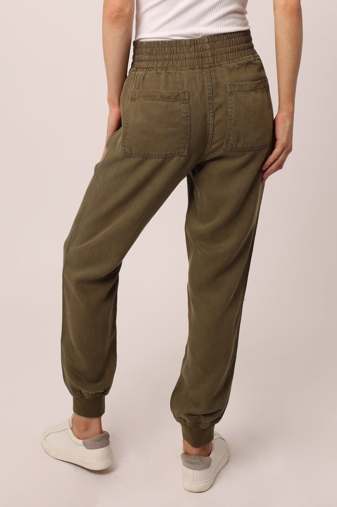image of a female model wearing a JACEY SUPER HIGH RISE CROPPED JOGGER PANTS CYPRESS PANTS