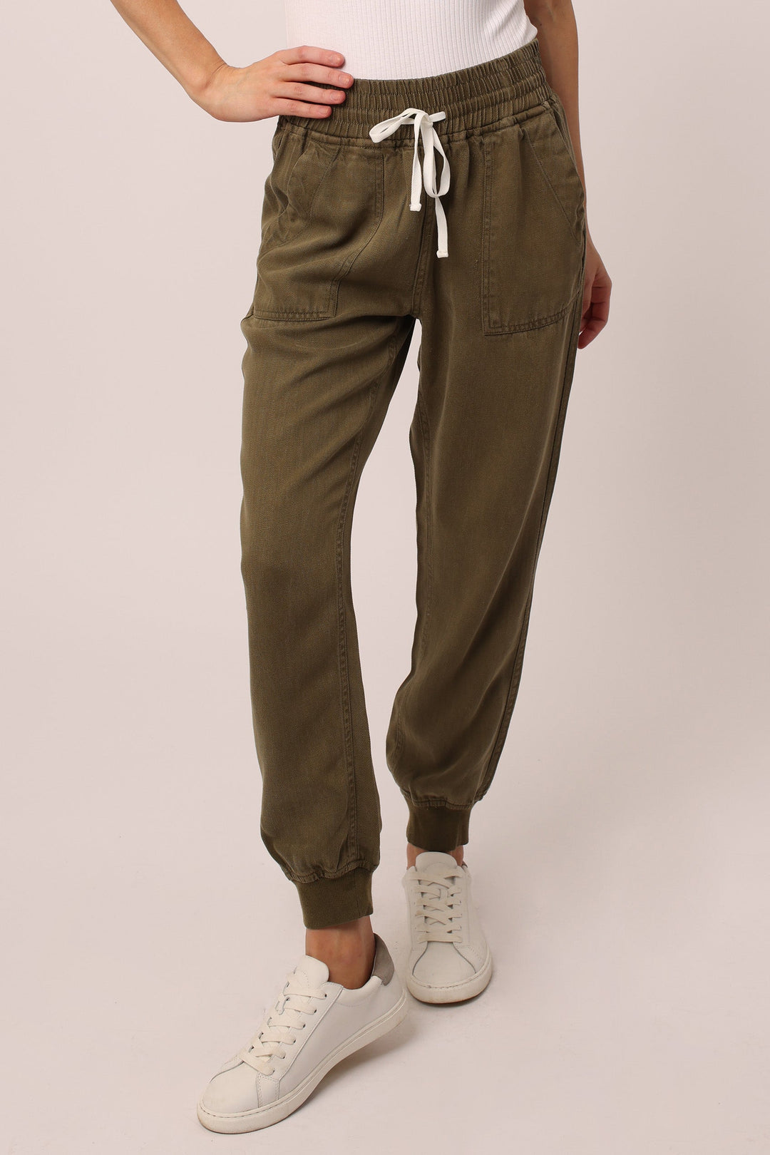 image of a female model wearing a JACEY SUPER HIGH RISE CROPPED JOGGER PANTS CYPRESS PANTS