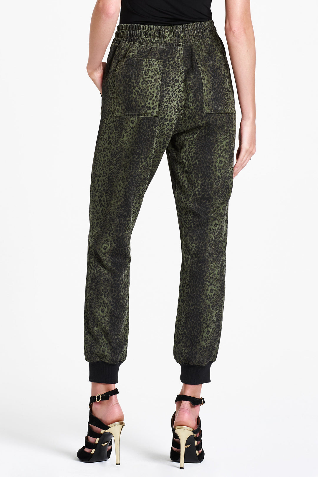 image of a female model wearing a JACEY SUPER HIGH RISE CROPPED JOGGER PANTS GREEN CHEETAH PANTS