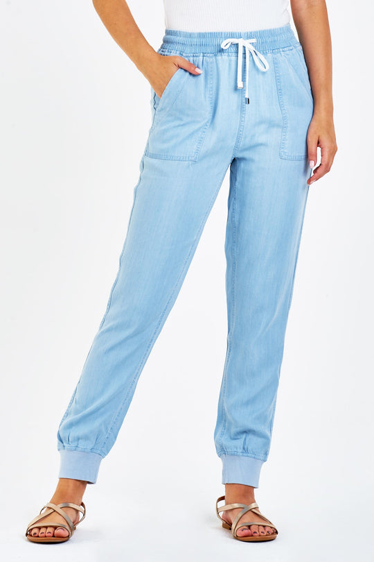 image of a female model wearing a JACEY SUPER HIGH RISE CROPPED JOGGER PANTS PERFECT BLUE PANTS