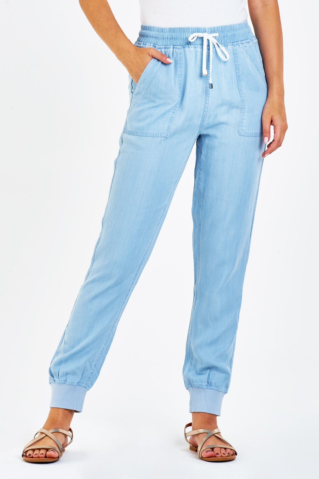 image of a female model wearing a JACEY SUPER HIGH RISE CROPPED JOGGER PANTS PERFECT BLUE DEAR JOHN DENIM 