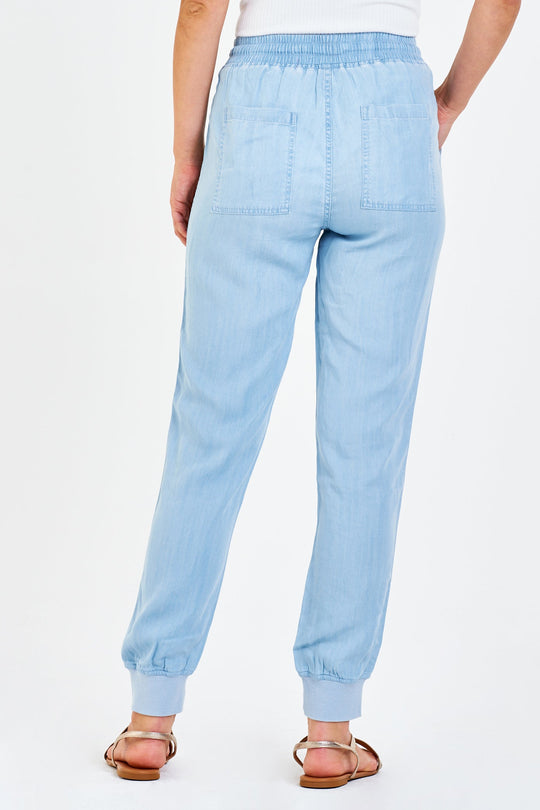 image of a female model wearing a JACEY SUPER HIGH RISE CROPPED JOGGER PANTS PERFECT BLUE DEAR JOHN DENIM 