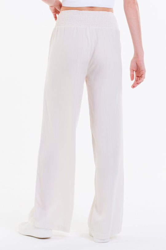 image of a female model wearing a LIZZIE LOUNGE PANTS OFF WHITE PANTS