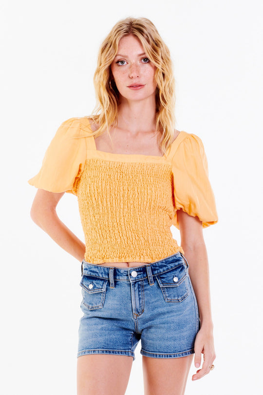 image of a female model wearing a PEIGHTON PUFF SLEEVE TOP CREAMSICLE TOPS