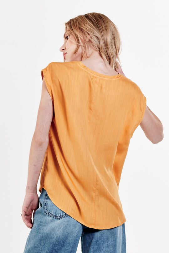 image of a female model wearing a YANIS SLEEVELESS TOP GOLDEN GLOW TOPS