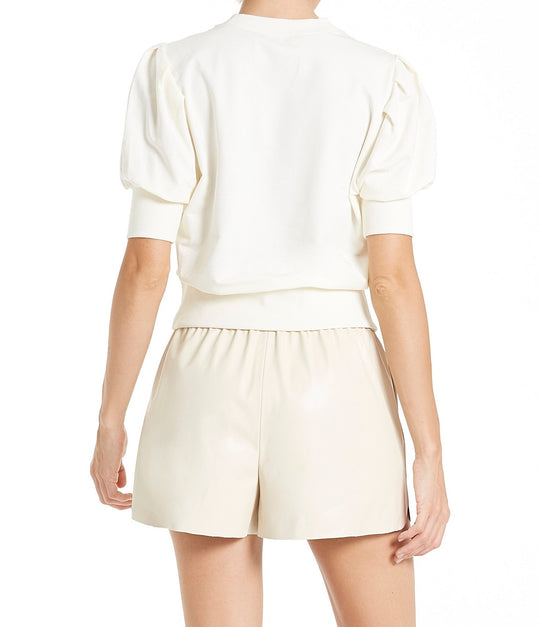 image of a female model wearing a NATALEE PUFF SLEEVE TOP CREAM TOPS