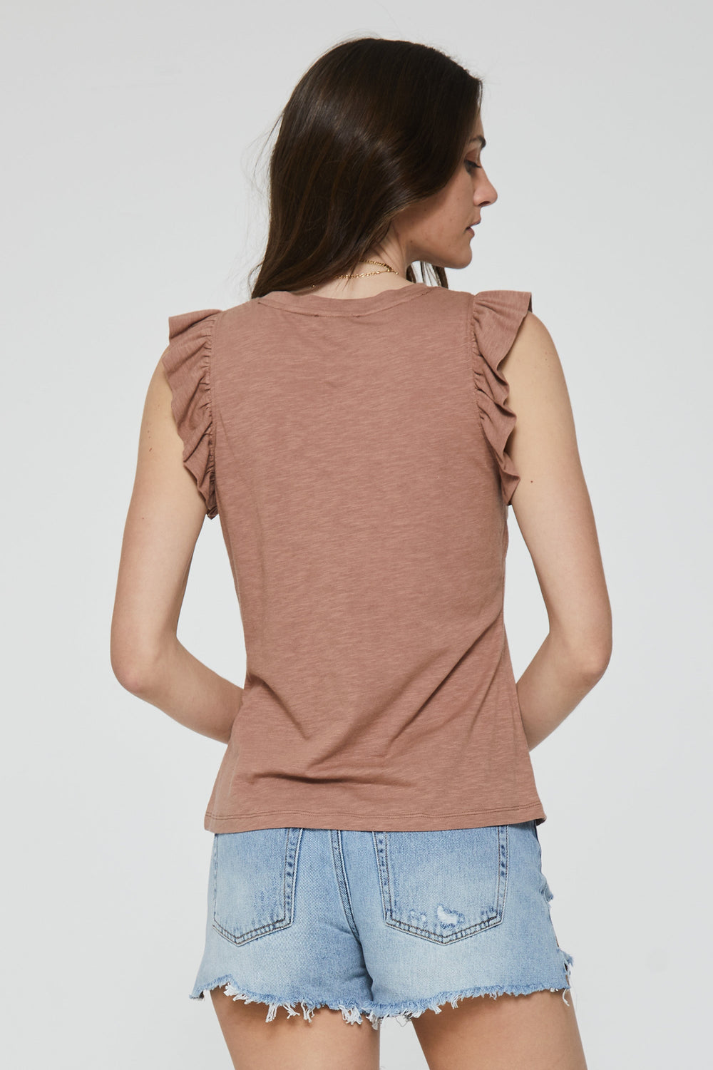 image of a female model wearing a NORTH RUFFLE TRIMMED TOP PINK CLAY DEAR JOHN DENIM 