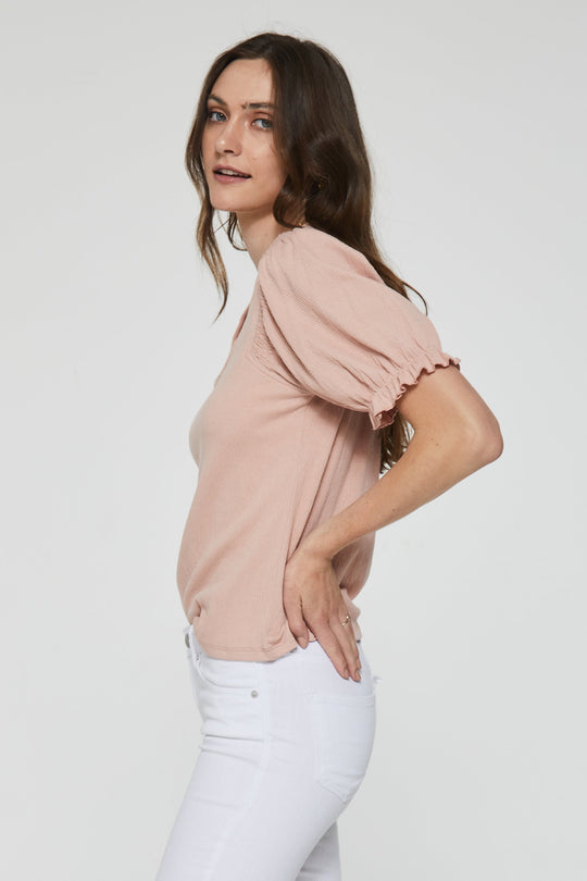 image of a female model wearing a ROZ SMOCKED SHOULDER TOP ROSE QUARTZ TOPS